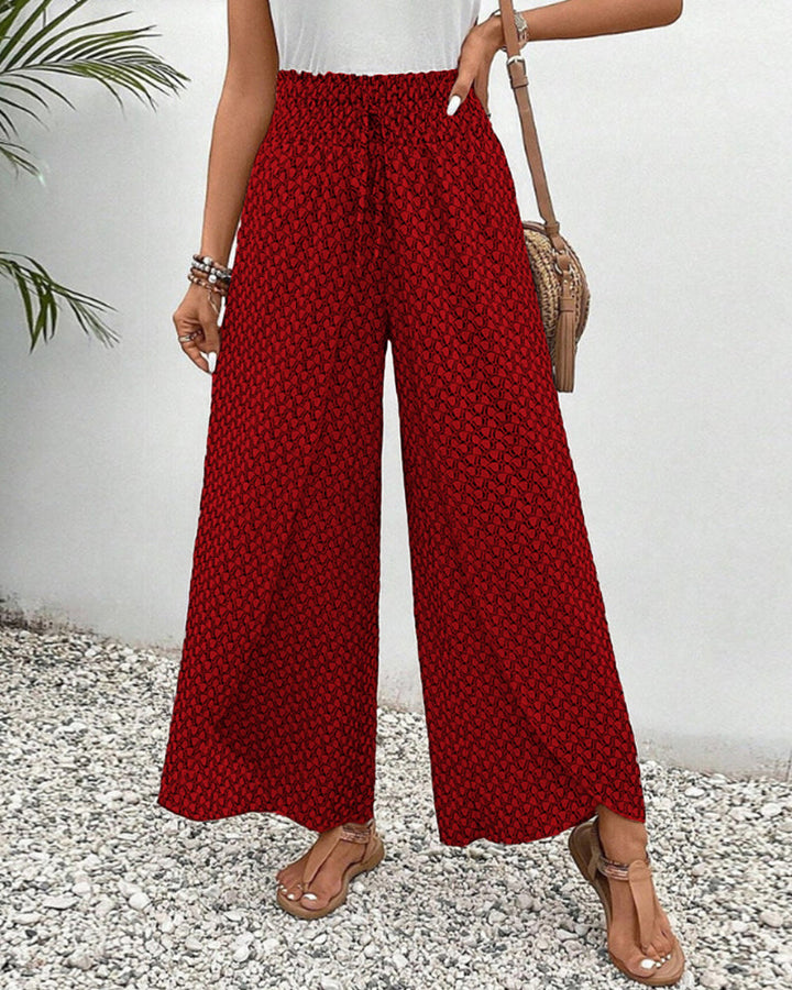 Weite Damenhose mit geometrischem Muster in Rückansicht