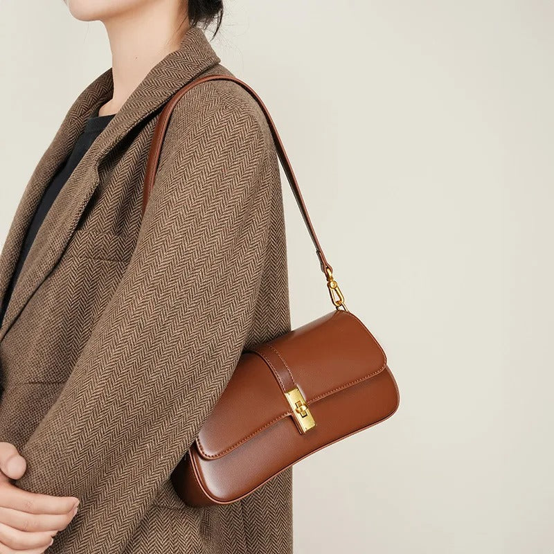 Helviora® | Glänzende Schultertasche mit goldener Schließe