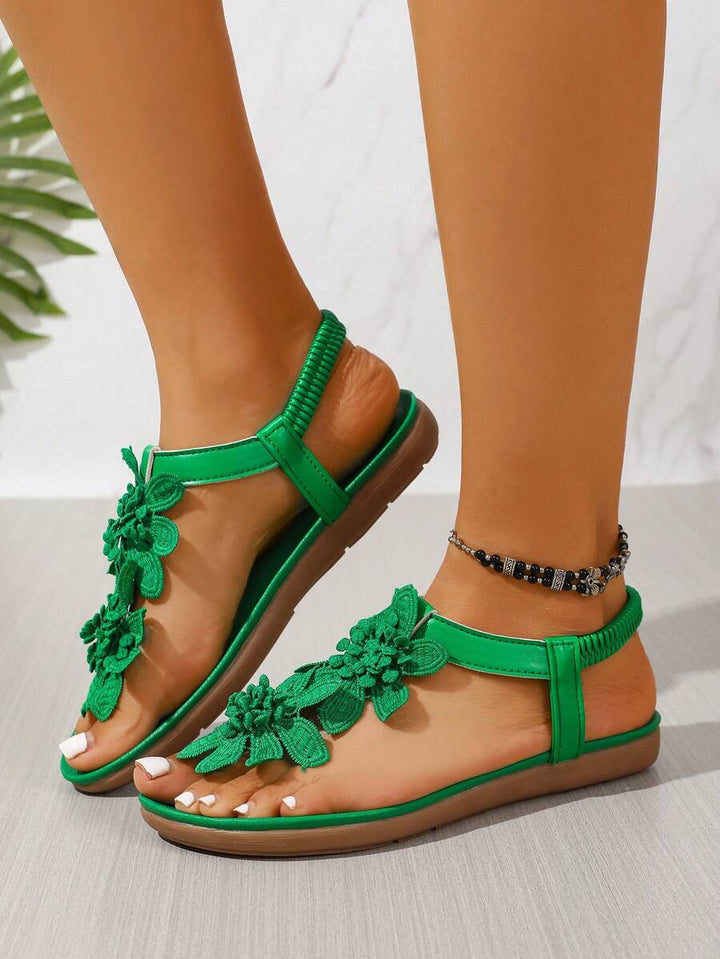 Seitenprofil der Damen Sandalen mit dekorativen Blumen