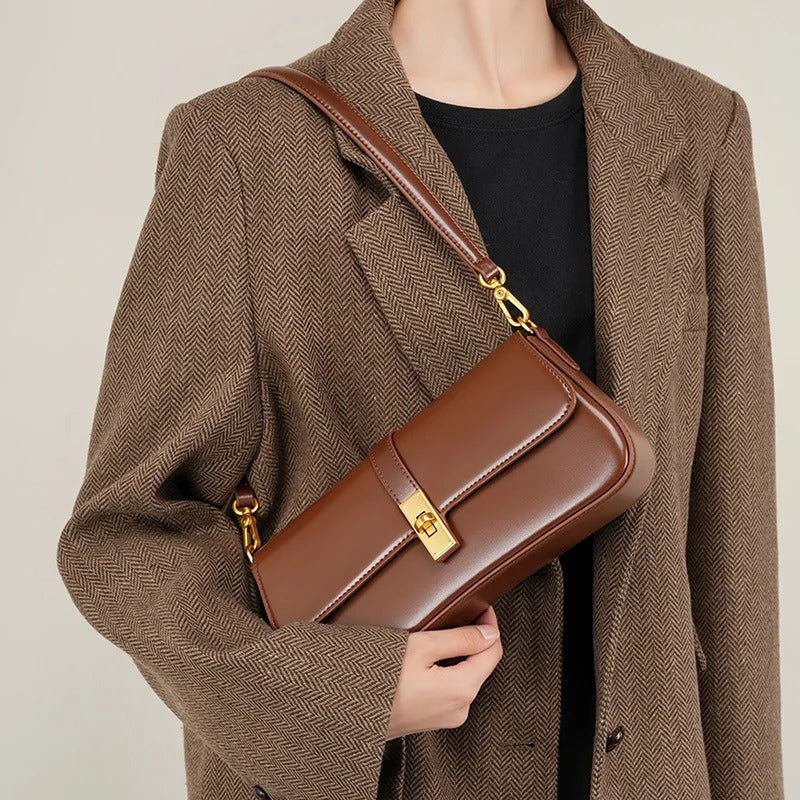 Helviora® | Glänzende Schultertasche mit goldener Schließe