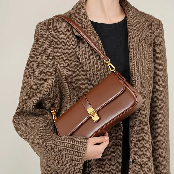 Helviora® | Glänzende Schultertasche mit goldener Schließe