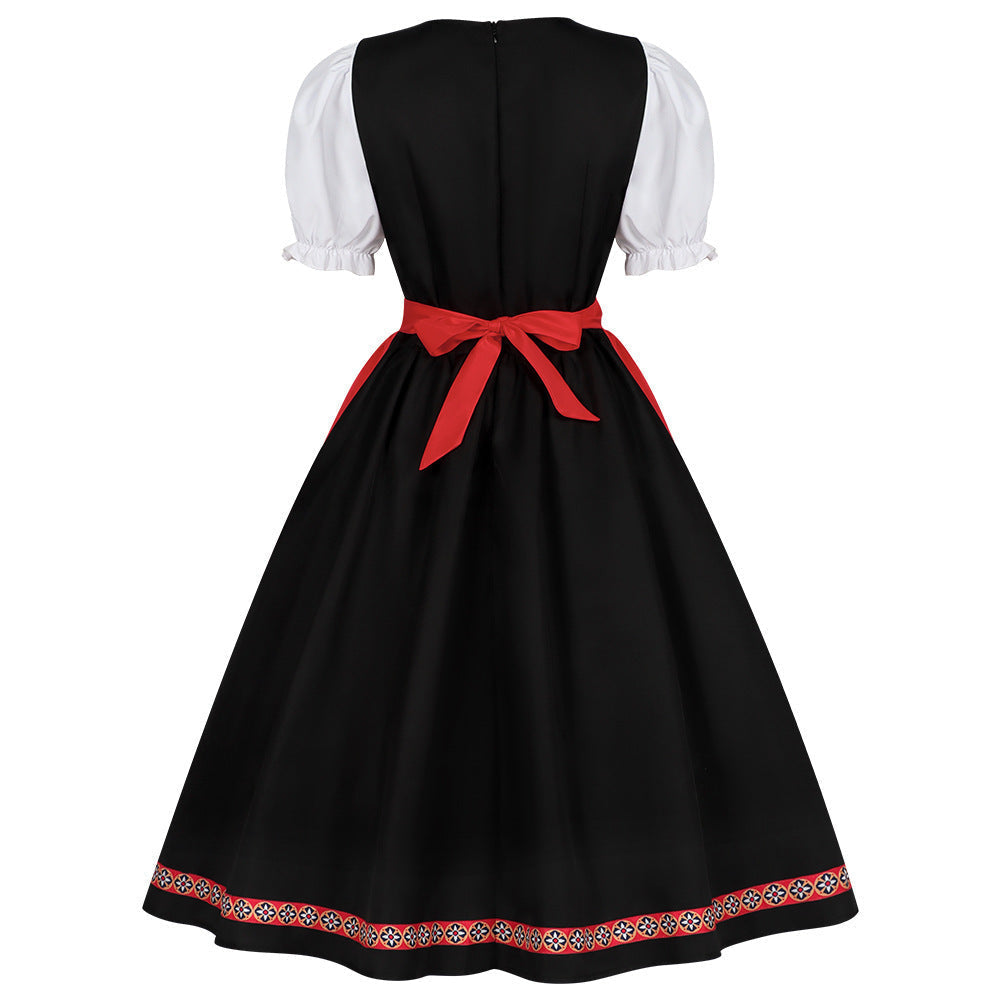 Damen-Dirndl mit dekorativen Puffärmeln und Schürze