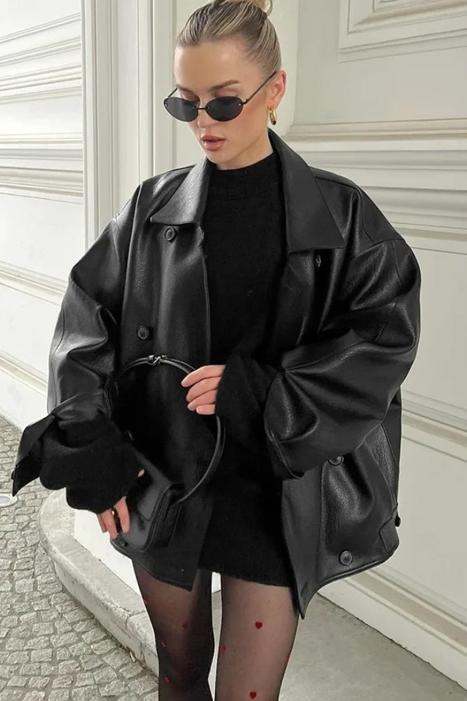 Double-breasted black leather coat with lapel collar 