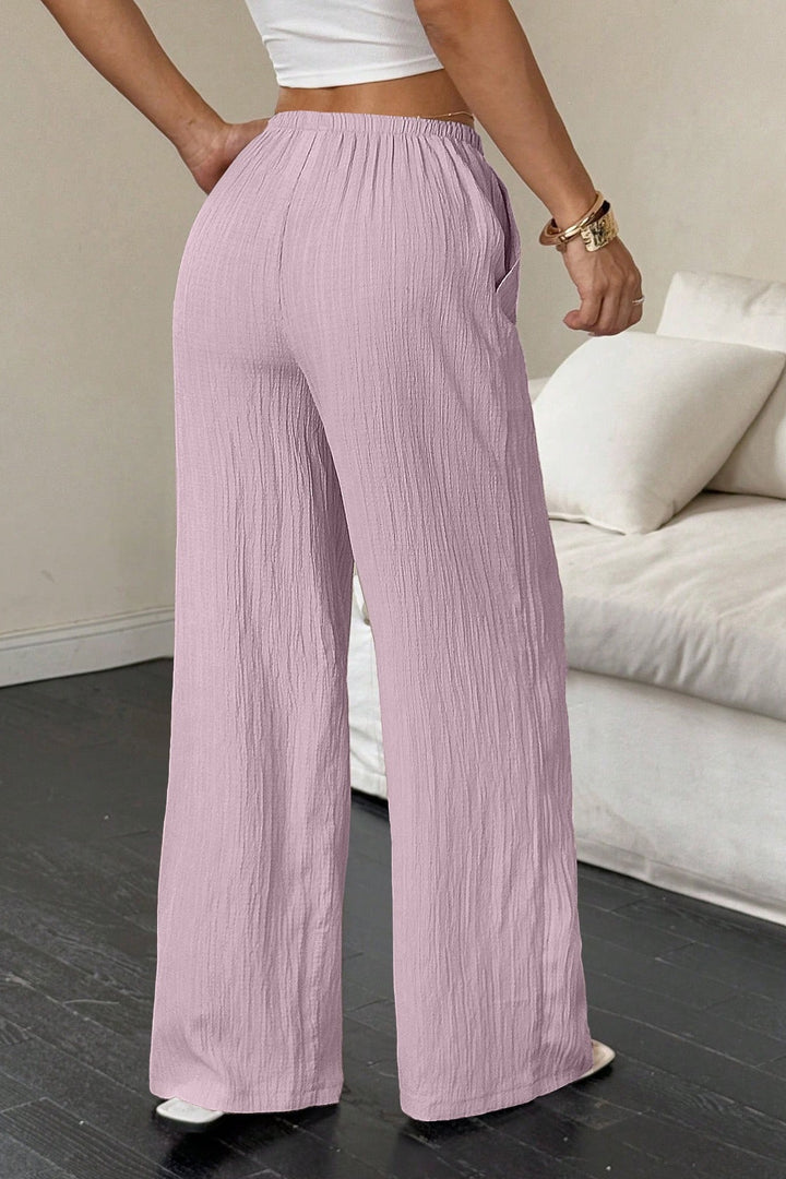 Damen Wide-Leg-Hose mit Strukturstoff und weitem Bein seitlich gezeigt
