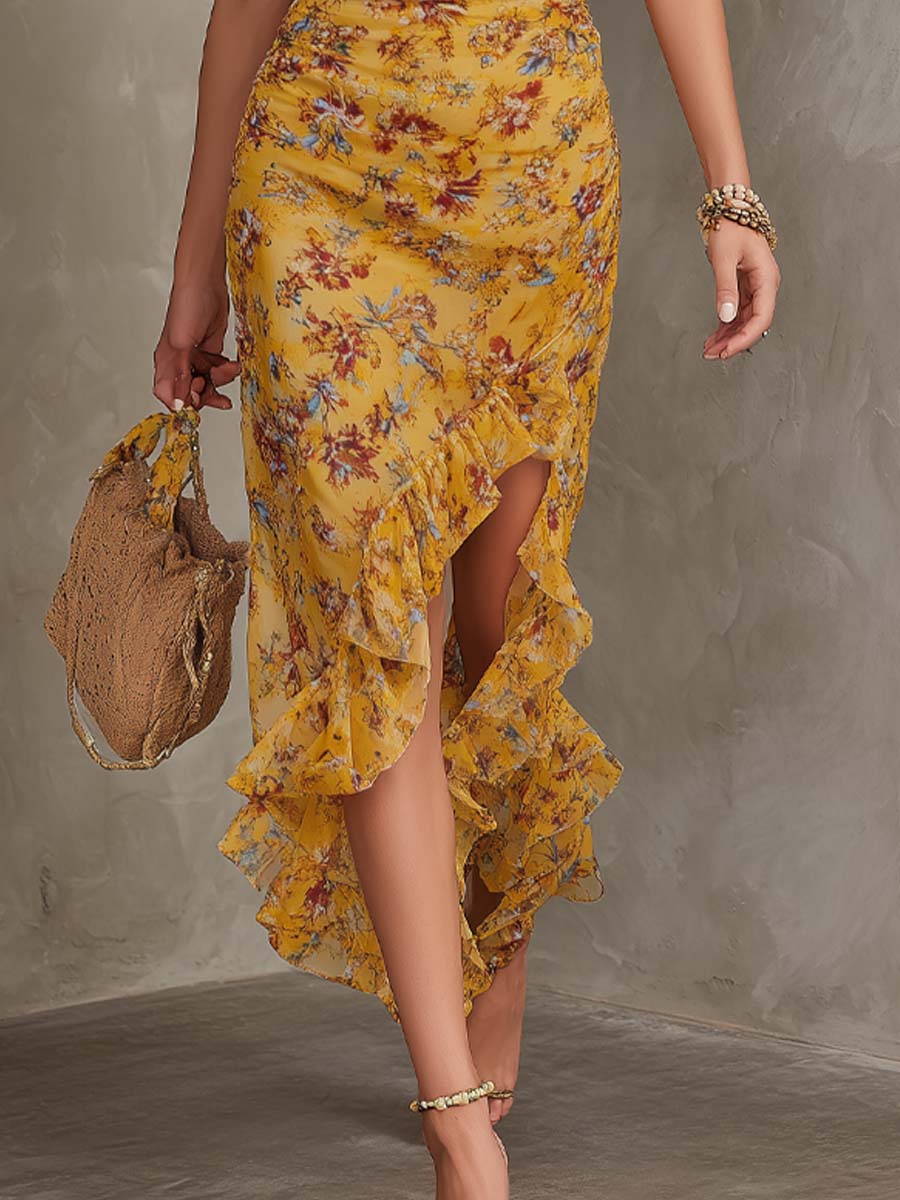 Detailansicht des gelben Midikleids mit Blumenprint und Neckholder-Ausschnitt